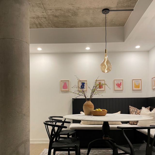 Elegant modern dining room featuring a chic built-in banquet.